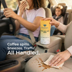 Person cleaning up a spill in a car with EcoFira products.